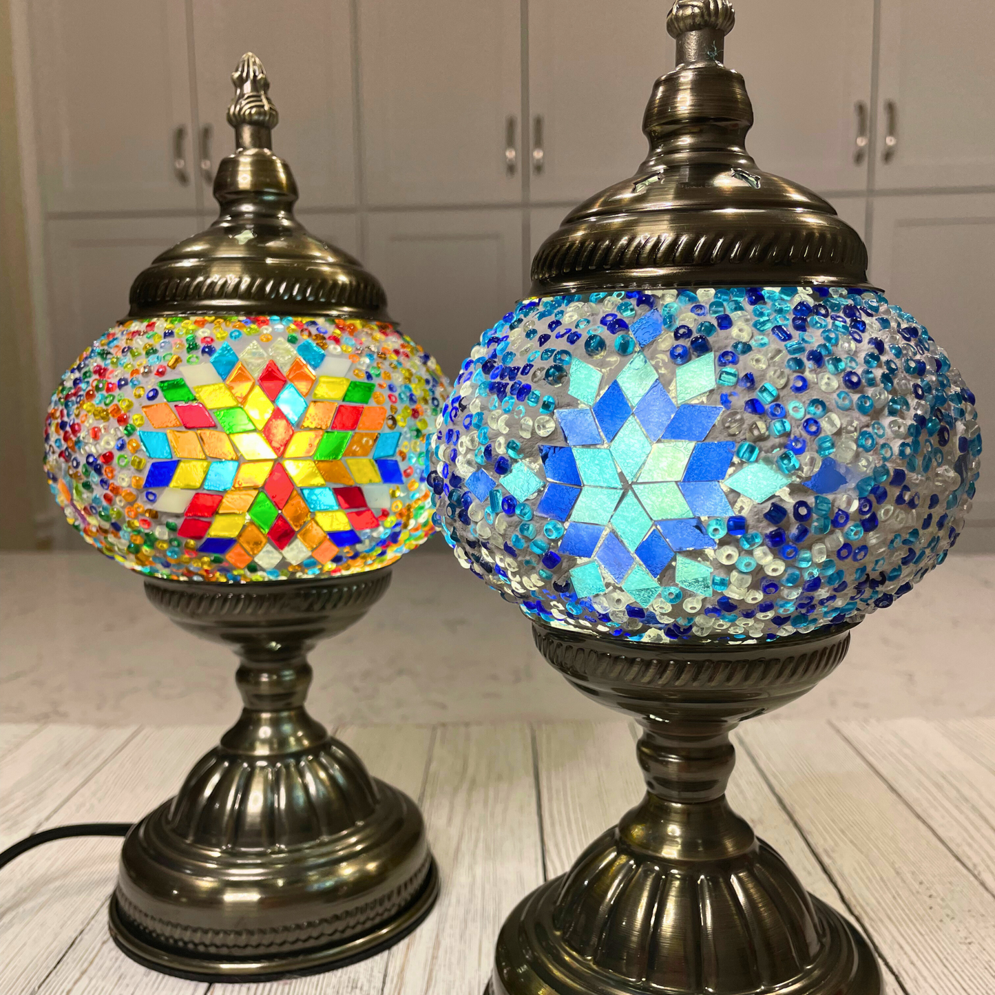 Finished Turkish Mosaic lamps; one multicolor and one blue.